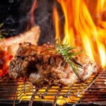 chef-cook-fries-meat-beef-steak-open-fire-restaurant_127425-660